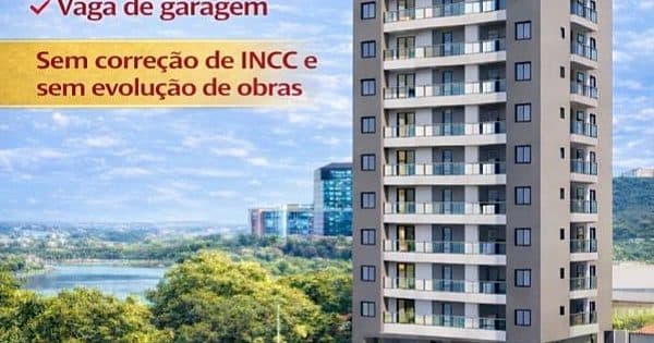 Fachada de edifício residencial com varandas e área verde ao redor.