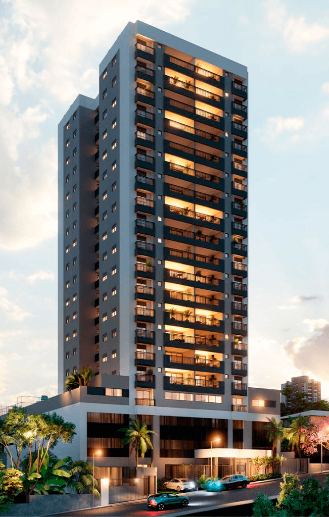 Fachada de edifício residencial moderno com varandas e iluminação noturna.