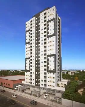Fachada de edifício residencial de torre única com design moderno em tons de cinza e branco.