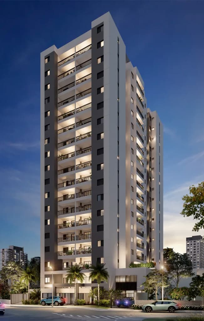 Fachada noturna de edifício residencial com varandas iluminadas e paisagismo na entrada.